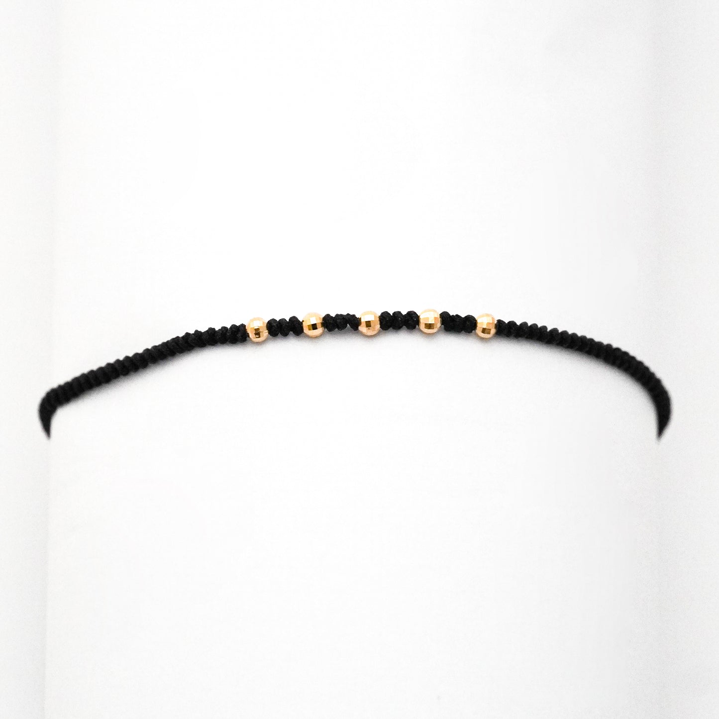 Pulsera tejida black line con bolitas diamantadas 2.5 mm en Oro18k