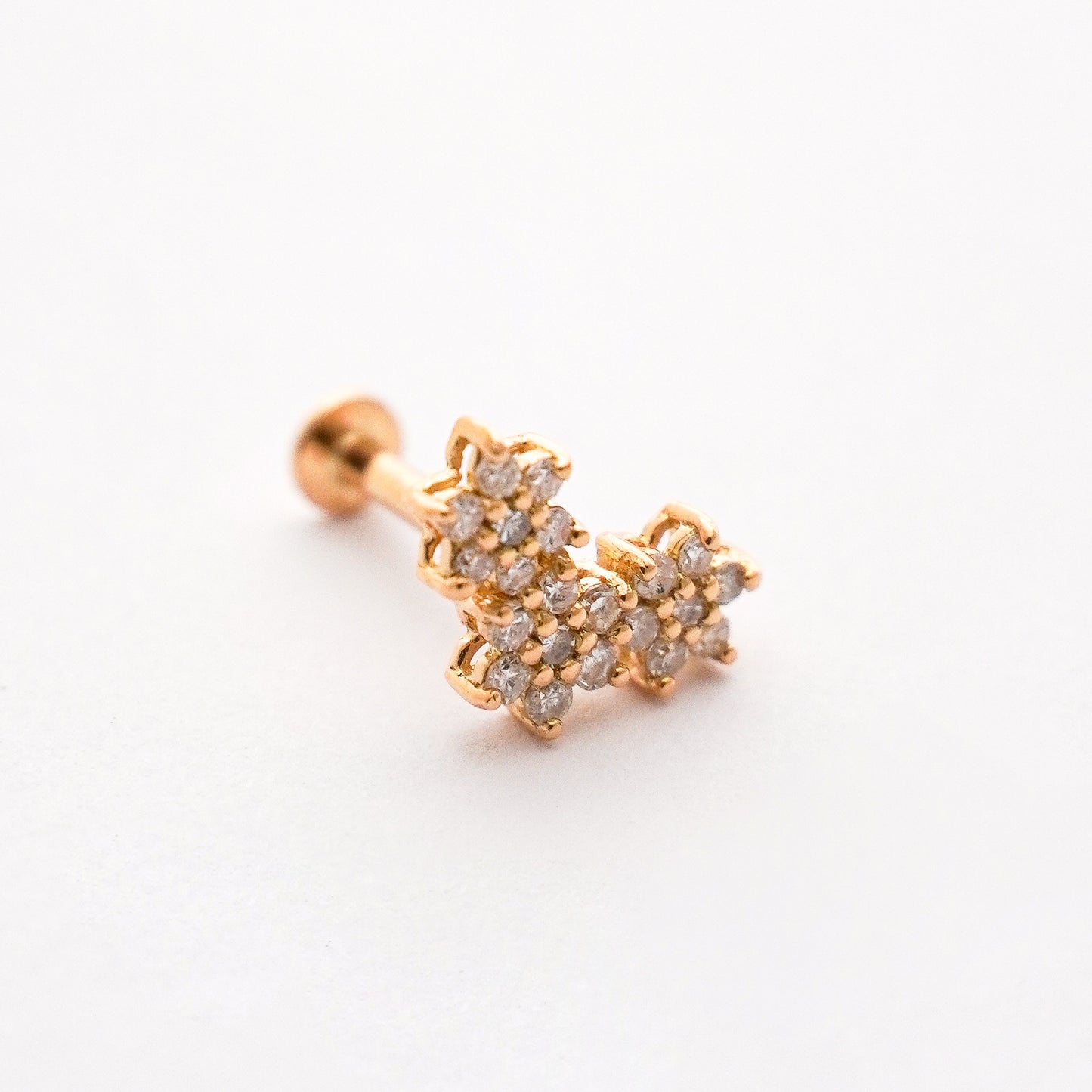 Piercing colgante triple roseta en Oro18k con diamantes naturales