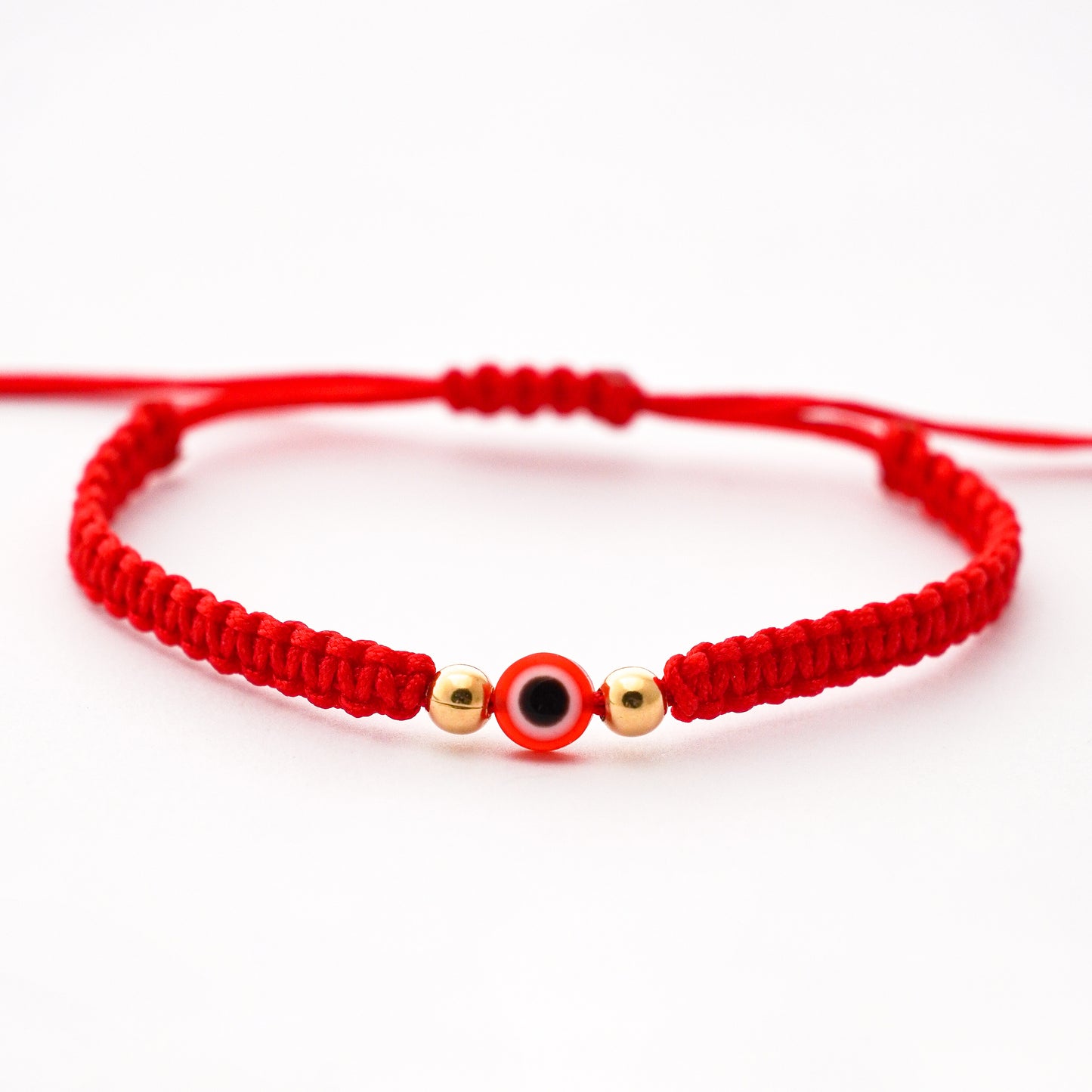 Pulsera tejida protectora con ojo turco y 2 bolitas 4 mm en Oro18k