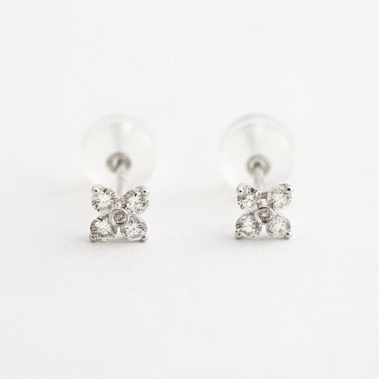 Aretes flor mini con diamantes naturales en Oro18k blanco