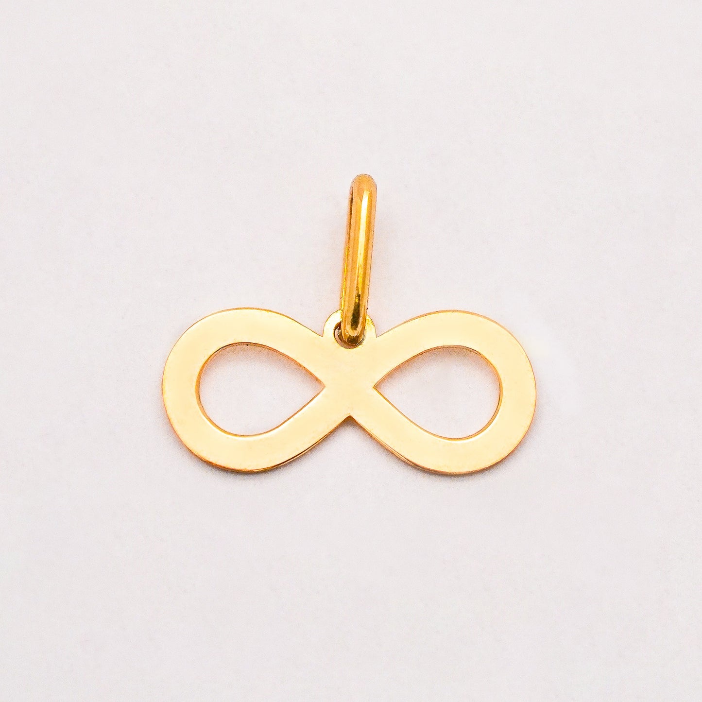 Dije infinito Oro18k