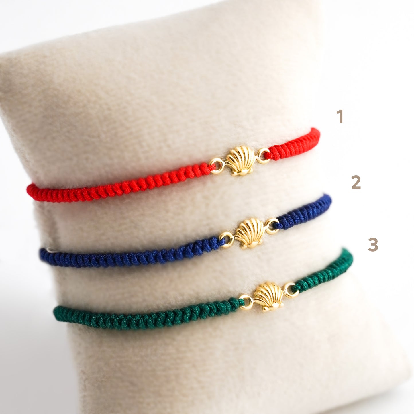 Pulsera tejida conchita de mar en Oro18k