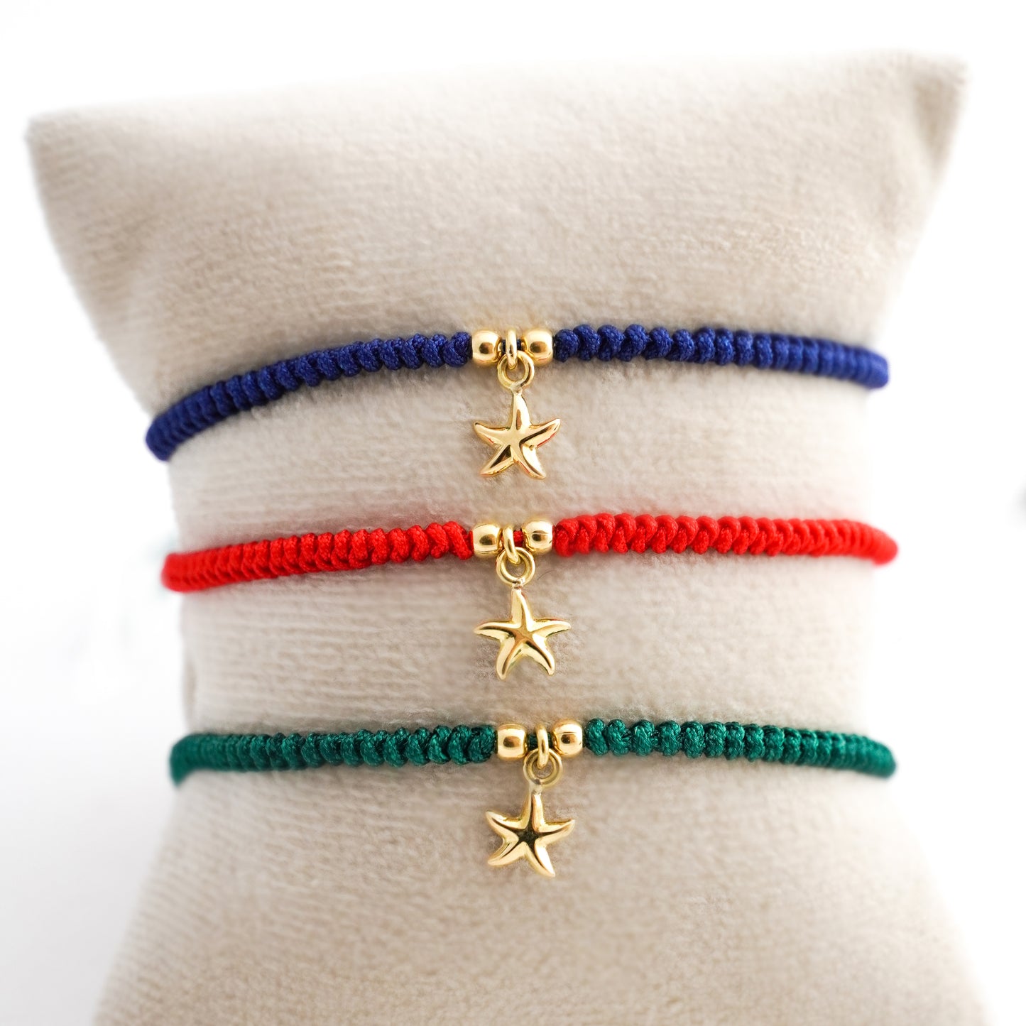 Pulsera tejida estrella de mar con dos bolitas en Oro18k