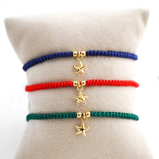 Pulsera tejida estrella de mar con dos bolitas en Oro18k
