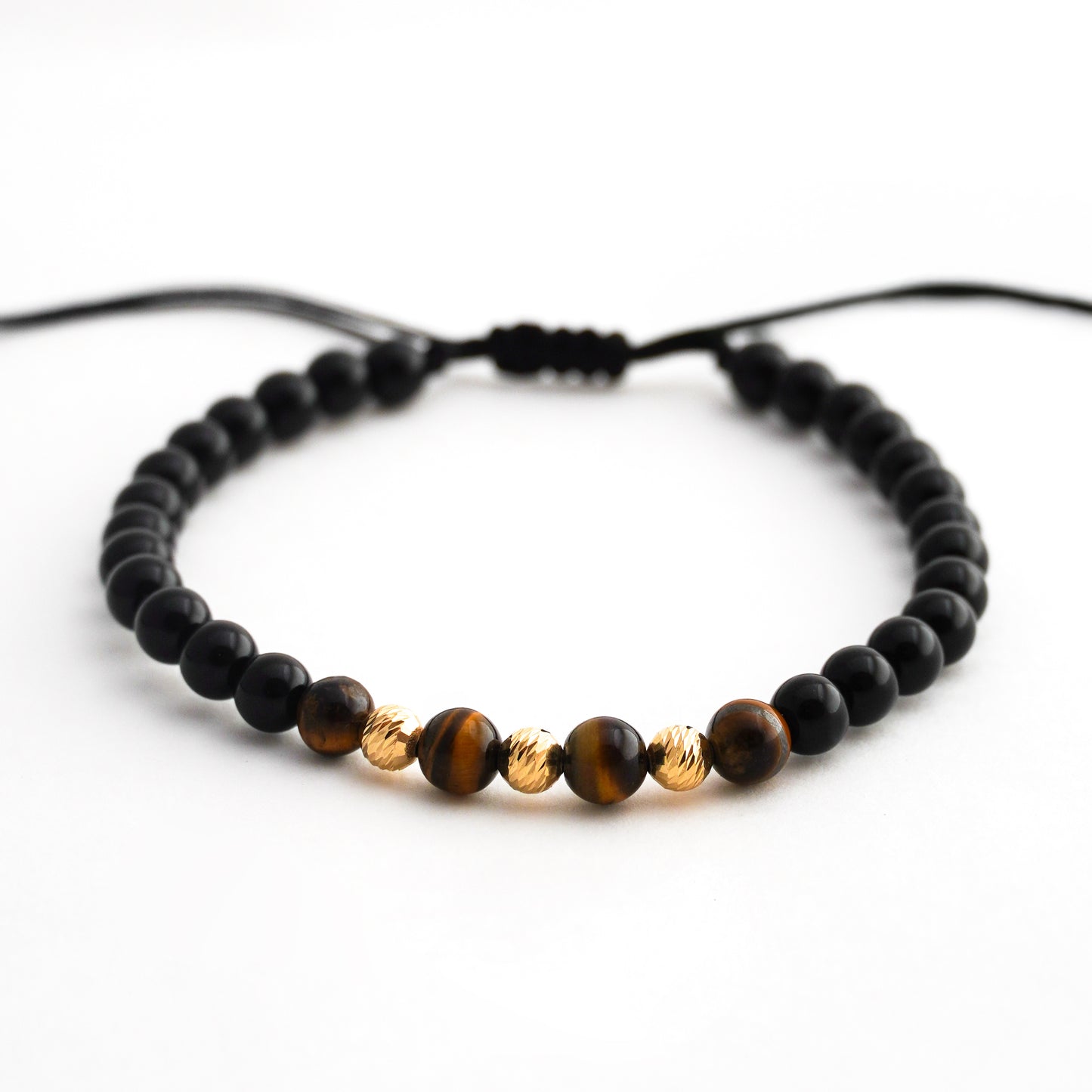 Pulsera tejida ónix y ojo de tigre con bolitas diamantadas 5mm en Oro18k