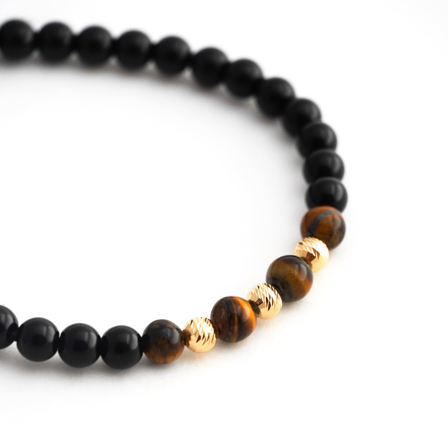 Pulsera tejida ónix y ojo de tigre con bolitas diamantadas 5mm en Oro18k