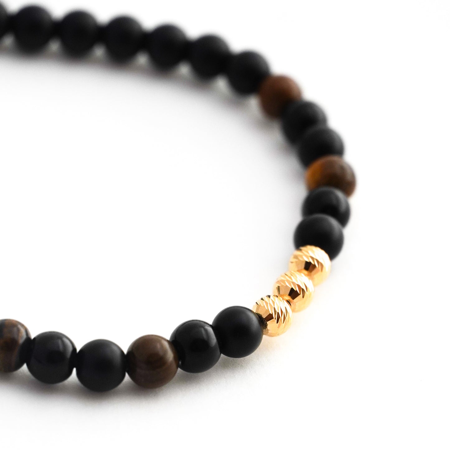 Pulsera tejida ónix y ojo de tigre con bolitas diamantadas 5mm en Oro18k