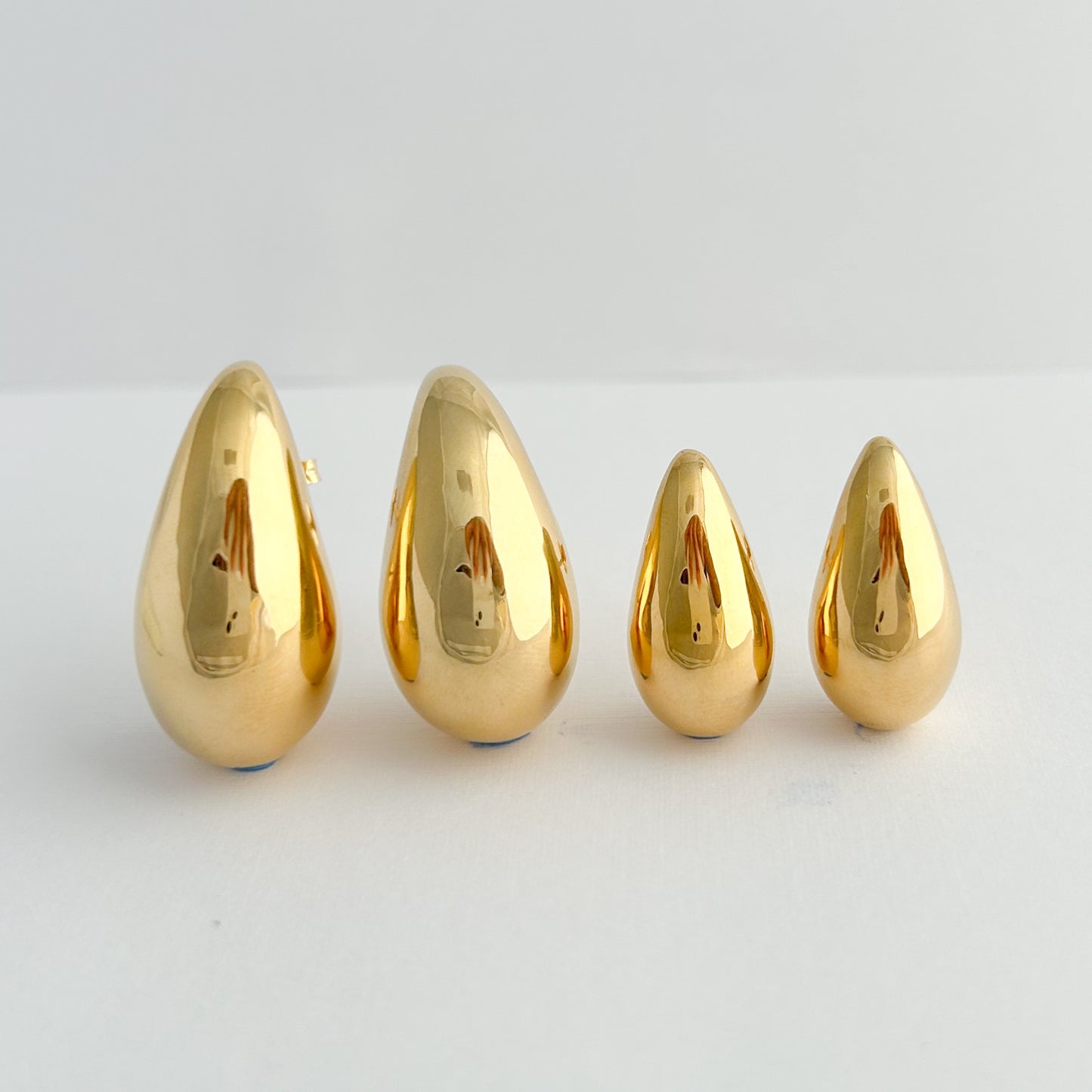 Aretes gota drop bombé oro 18k