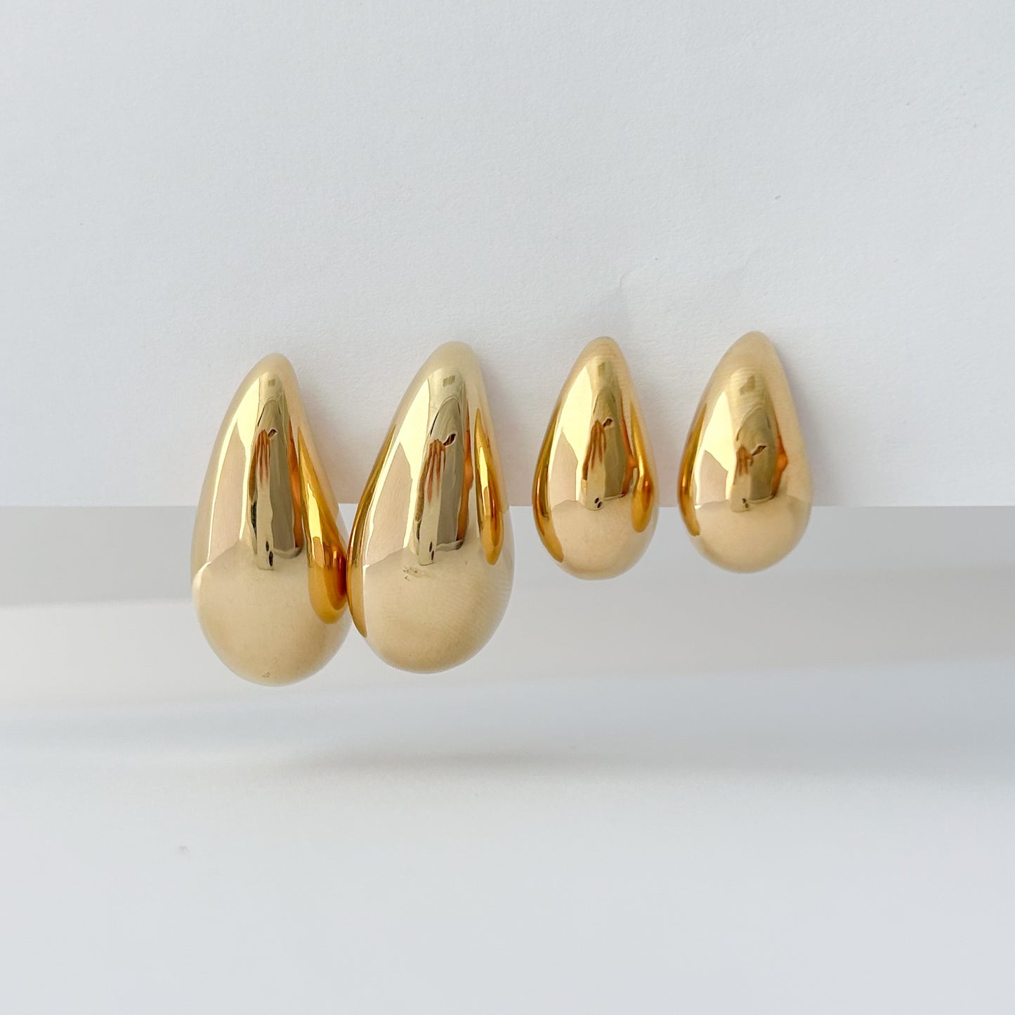 Aretes gota drop bombé oro 18k