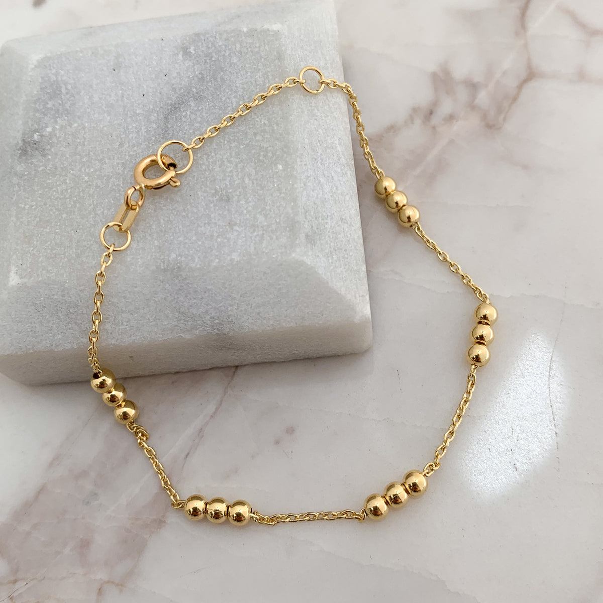 Pulsera Tres Bolitas en Oro 18K
