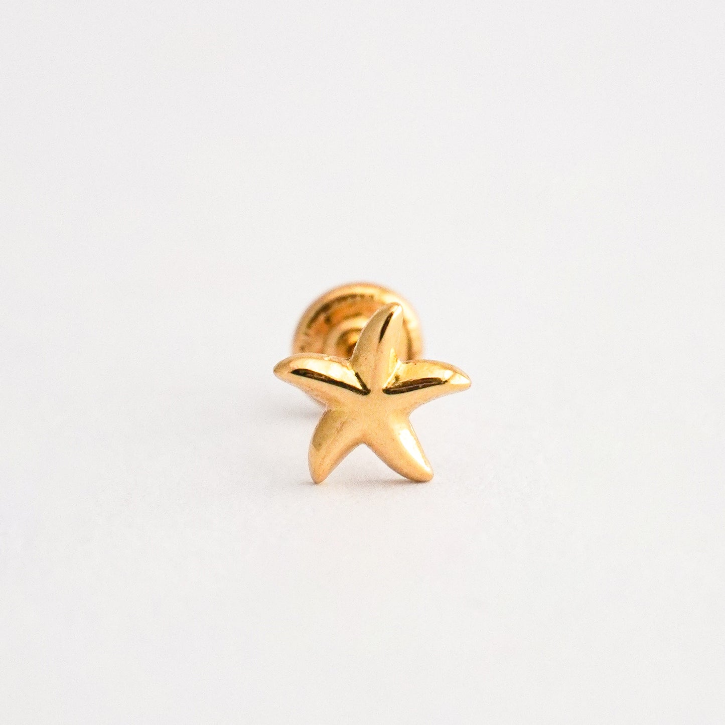 1/2 par arete bebé Estrella de Mar Oro 18k