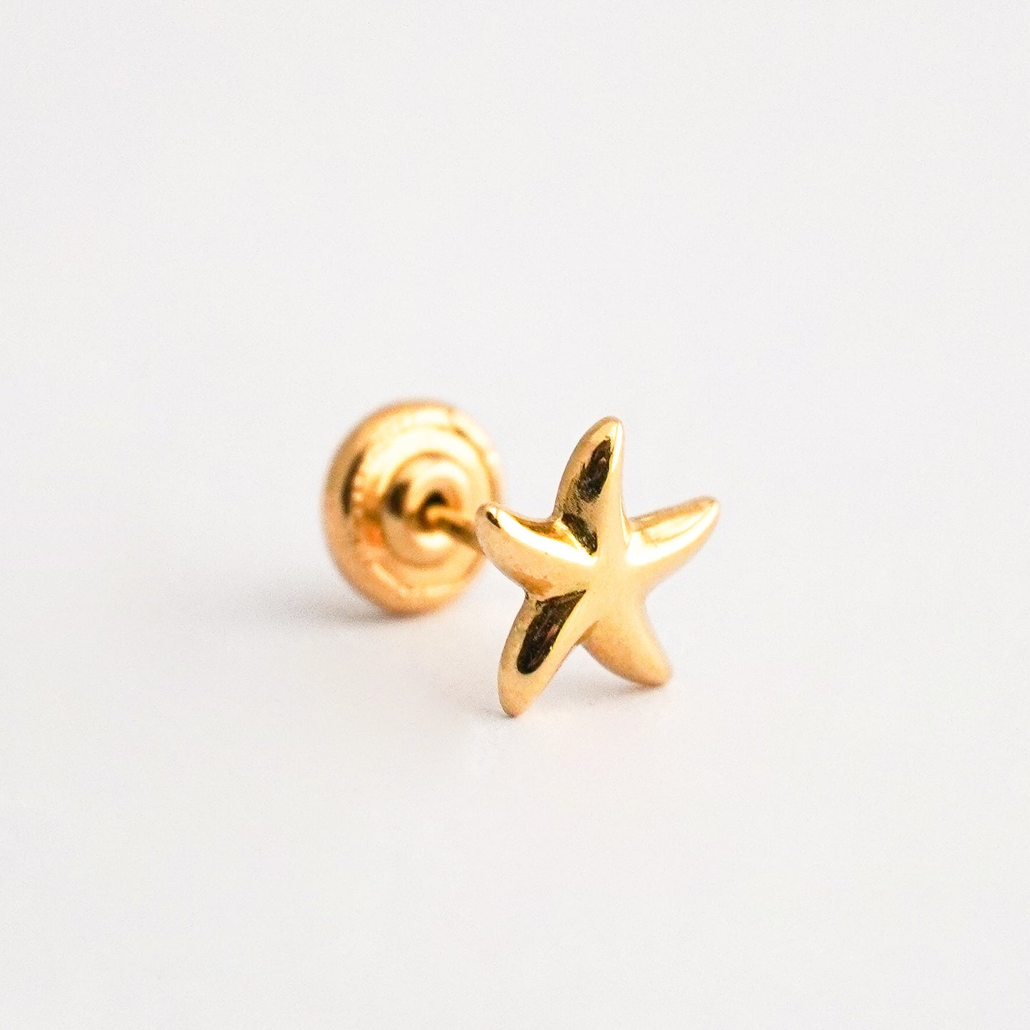 1/2 par arete bebé Estrella de Mar Oro 18k