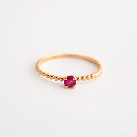 Anillo bolitas con rubi en oro18k