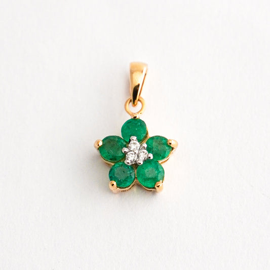 Dije Roseta trina con esmeraldas en oro 18k