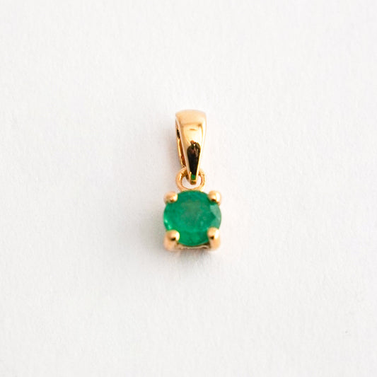 Dije punto de luz esmeralda en oro18k