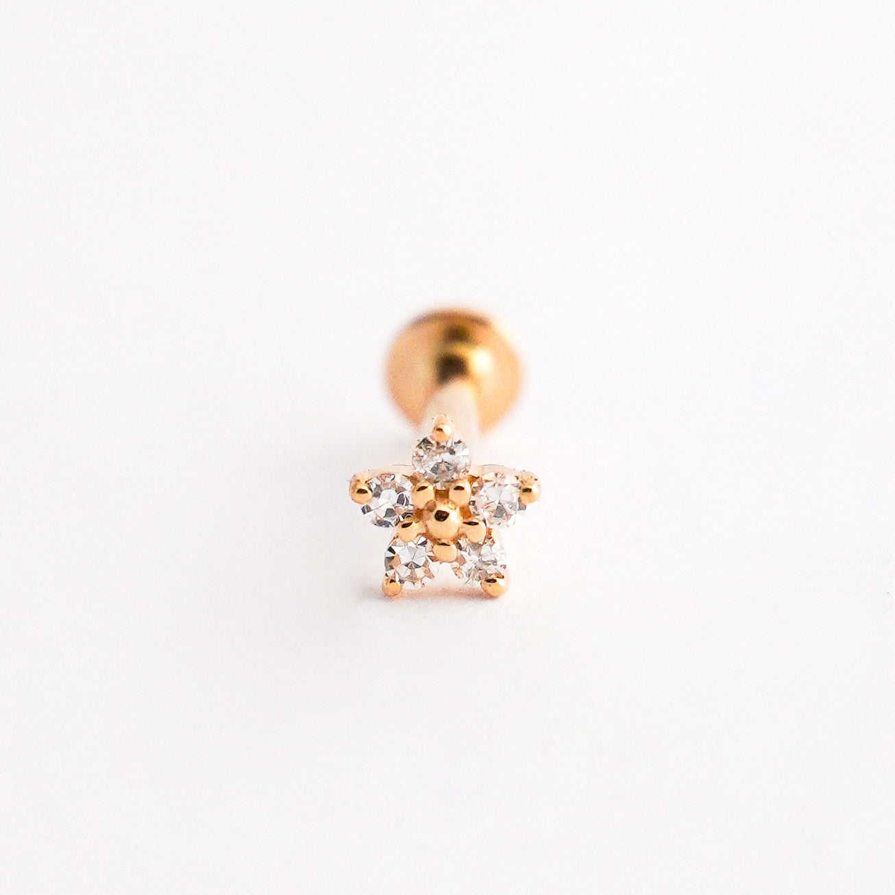 Piercing mini flor en Oro18k con diamantes naturales