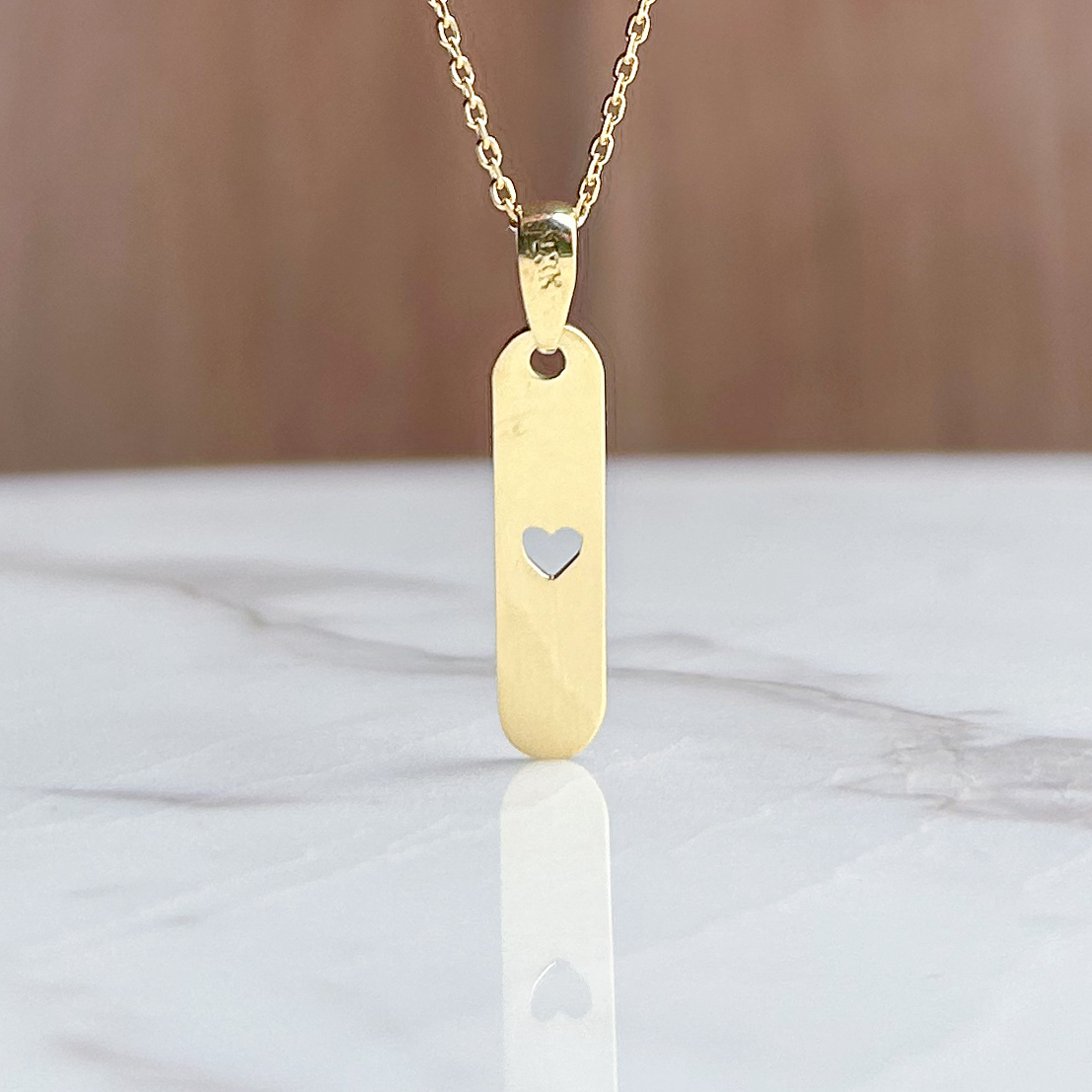 Dije de Placa con corazón calado oro 18k